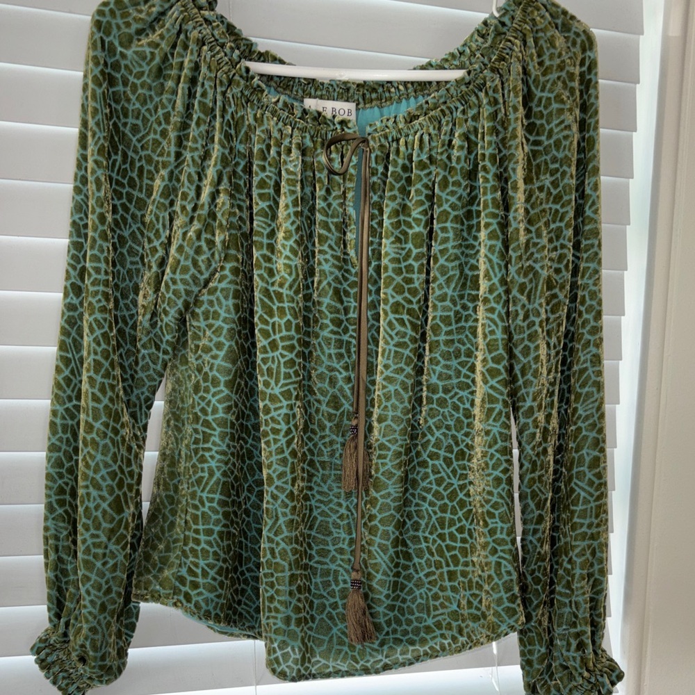 HALE BOB OLIVE GREEN VELOUR SHIRT ON A LIGHT BLUE BACKGROUND ELASTIC NECKLINE